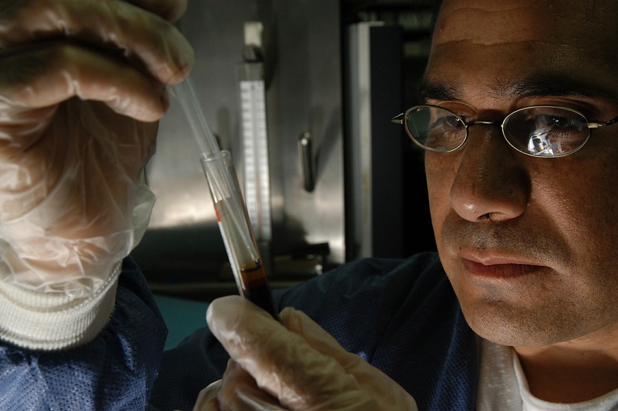 US Navy 031206-N-6278K-001 Hospital Corpsman 2nd Class Carlos Aguilar, of Baja, Calif., conducts lab tests in the medical clinic aboard USS George Washington 