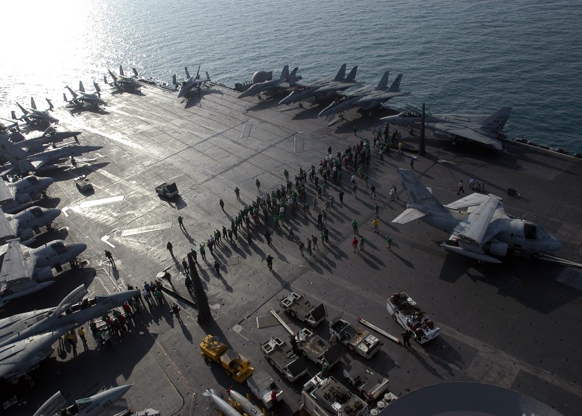 US Navy 040105-N-6187M-002 Sailors carefully scour the flight deck aboard USS Enterprise (CVN 65) for Foreign Object Debris (FOD) prior to the day^rsquo,s flight operations