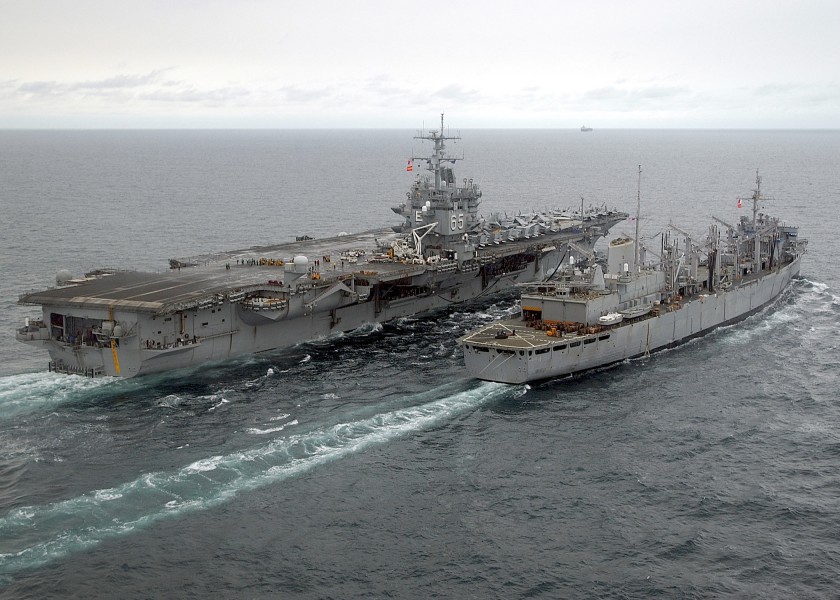 US Navy 040110-N-5405H-001 The fast combat support ship, USS Detroit (AOE-4) steams alongside USS Enterprise (CVN 65) while conducting an early morning Replenishment at Sea (RAS)