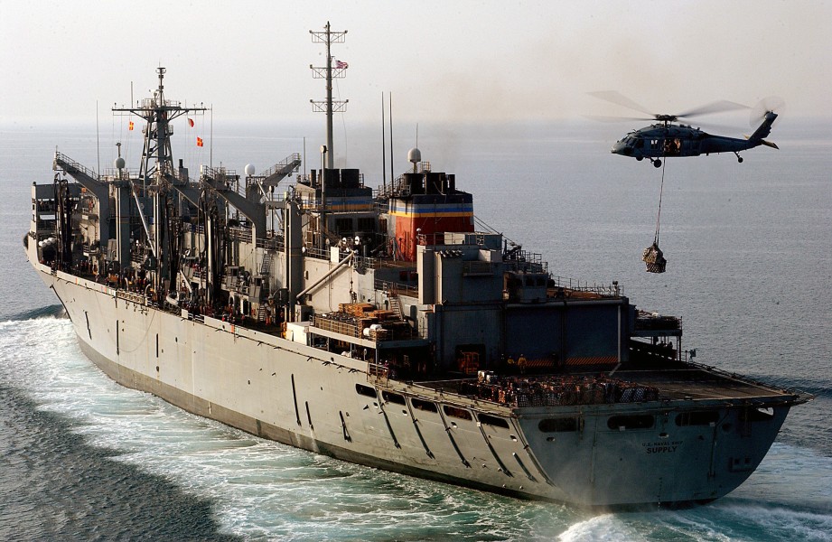 US Navy 040331-N-1045B-008 A MH-60S Knighthawk conducts a vertical replenishment at sea with the Military Sealift Command (MSC) fast combat support ship USNS Supply (T-AOE 6)