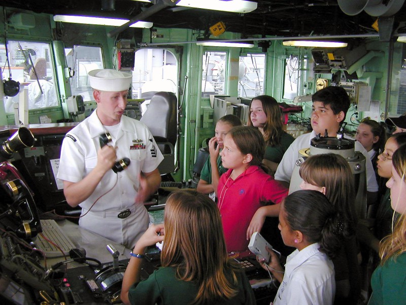 US Navy 040428-N-2038L-003 Operations Specialist 1st Class David S. Smith shows students from Peace Lutheran School, Davie, Fla., the sound powered