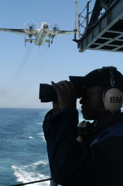 US Navy 040603-N-1087H-001 Seaman Apprentice Andre Marsh, of Lilbourn, Mo., stands watch on the fantail aboard the aircraft carrier USS Enterprise (CVN 65)