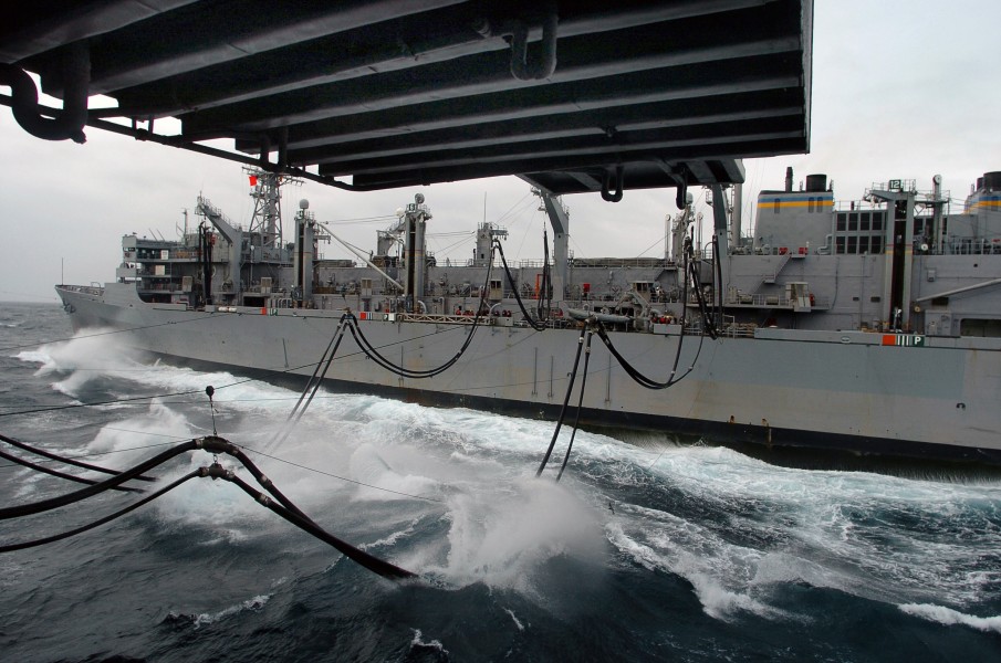 US Navy 040612-N-6213R-020 Fuel transfer lines from the Military Sealift Command (MSC) fast combat support ship USNS Rainer (T-AOE 7) are consumed by rough Alaskan seas