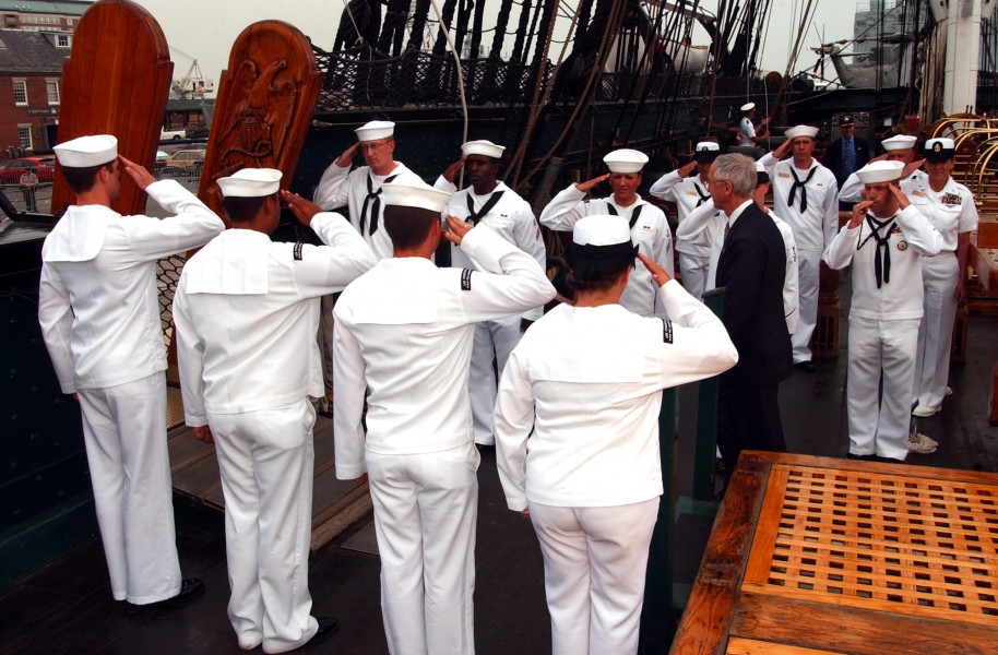US Navy 040625-N-2568S-005 Secretary of the Navy, Gordon R. England is piped ashore by the honors Boatswain assigned to USS Constitution, following a tour of the ship