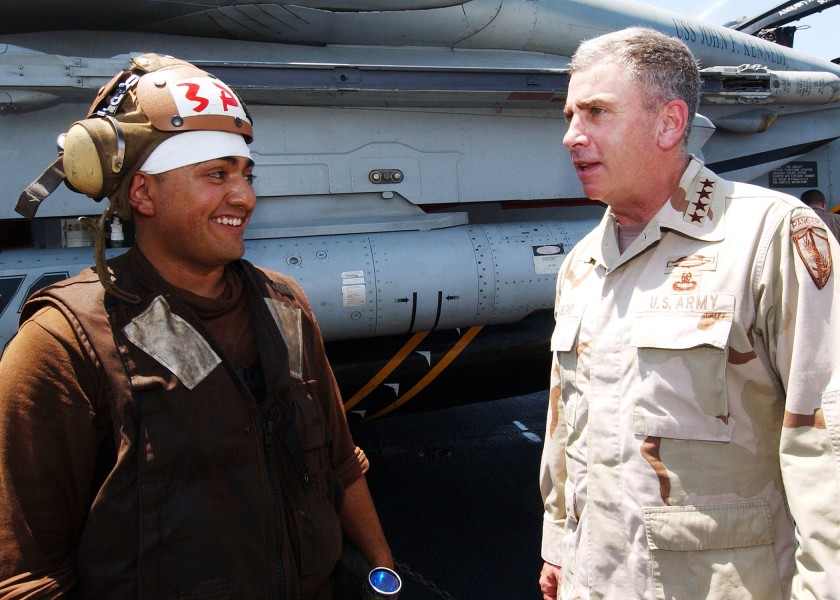 US Navy 040719-N-4374S-006 A member of the flight deck crew speaks with General John Abizaid, Commander, U.S. Central Command, on the flight deck of USS John F. Kennedy (CV 67)