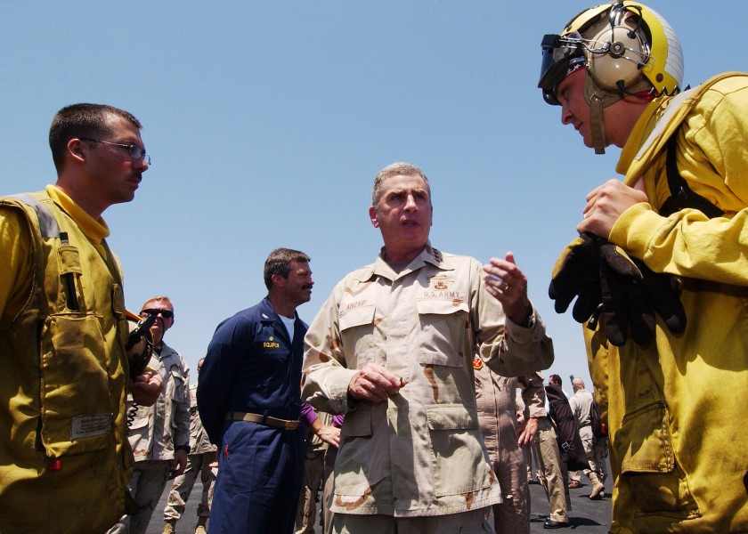 US Navy 040719-N-4374S-007 General John Abizaid Commander, U.S. Central Command, speaks with a Sailor on the flight deck of USS John F. Kennedy (CV 67)