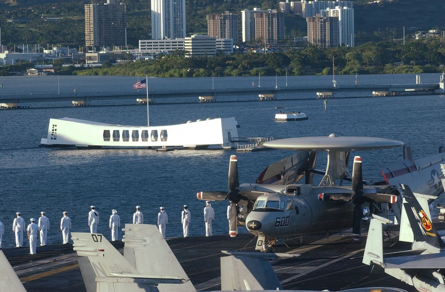 US Navy 040722-N-0511C-224 Sailors man the rails aboard USS John C Stennis (CVN 74) while passing the USS Arizona Memorial as they pull into Pearl Harbor, Hawaii for a port visit