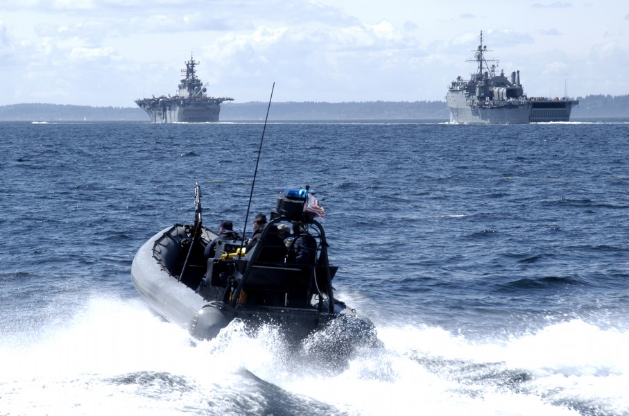 US Navy 040805-N-0683J-270 A Coast Guard patrol boat cruises the surrounding waters while a parade of U.S. Naval ships is underway. The parade is a segment of Seattle's traditional summer festival