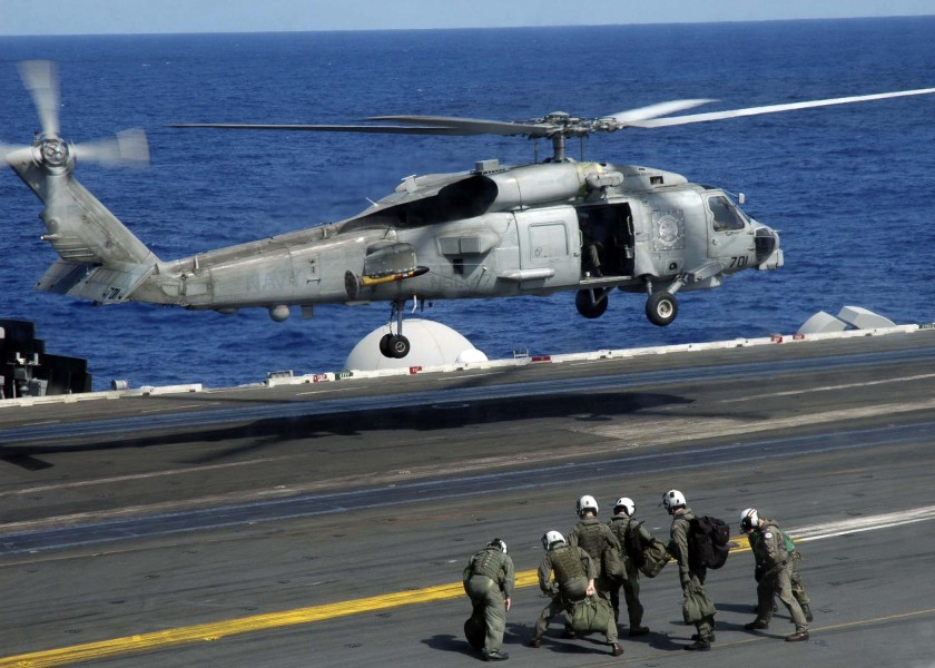 US Navy 041117-N-9293K-251 A SH-60B Seahawk repares to land aboard the Nimitz-class aircraft carrier USS Abraham Lincoln (CVN 72)