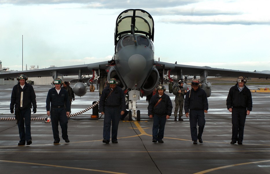US Navy 041119-N-5134H-002 Troubleshooters conducts a Foreign Object Debris (FOD) walk down forward of an EA-6B Prowler during a pre-flight inspection