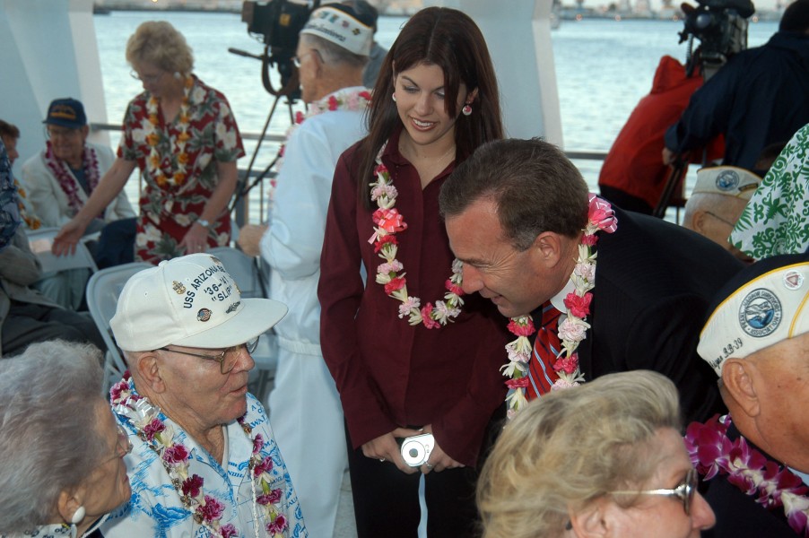 US Navy 041207-N-6775N-031 Senator Jim Reynolds (R-OK) and his daughter speaks with retired Chief Engineman Charles W. Slip Hailslip about his experiences aboard USS Arizona