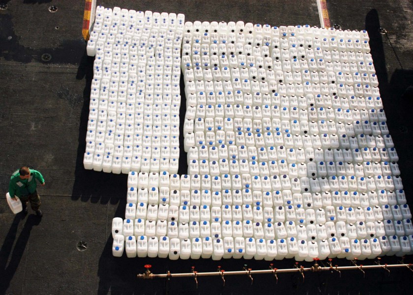 US Navy 050107-N-6060O-034 Jugs of purified water are staged on the flight deck aboard USS Abraham Lincoln (CVN 72) for delivery to the Island of Sumatra, Indonesia