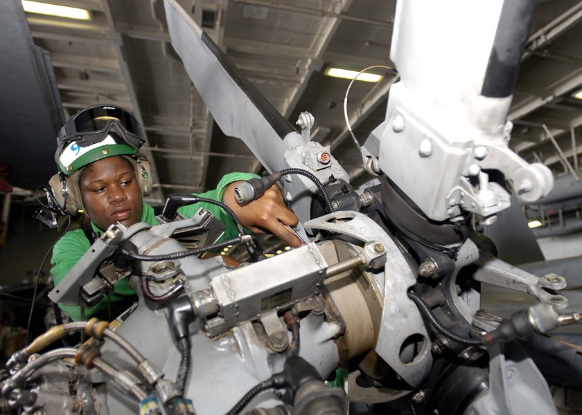 US Navy 050112-N-9079D-154 Aviation Electrician's Mate Airman Jamika Fletcher, of Long Beach, Calif., conducts a phase inspection on the tail rotor of a SH-60B Seahawk
