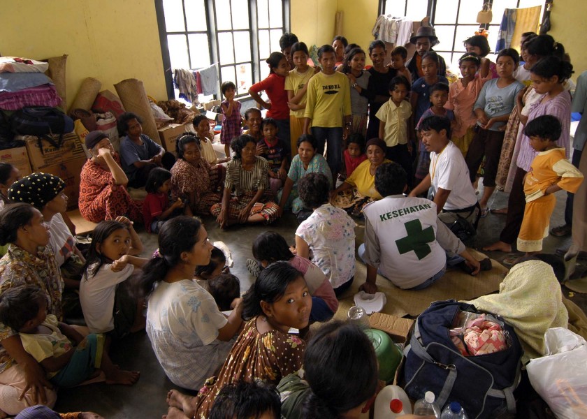 US Navy 050119-N-9951E-109 Representatives from the United Nations (UN) and the World Health Organization (WHO) converse with Indonesian nationals living at a camp located in the town of Alue Bilie, Aceh