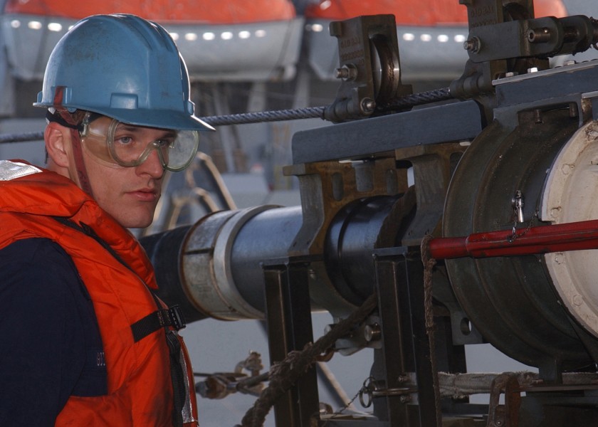 US Navy 050123-N-7405P-025 Boatswain's Mate 3rd Class Jacob Goodman ensures that the fuel probe is seated with the receiver on a fueling station aboard USS Harry S. Truman (CVN 75) 