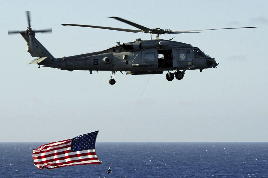 US Navy 050219-N-4166B-123 An HH-60H Seahawk helicopter performs a fly by during a flight demonstration aboard the Nimitz-class aircraft carrier USS Abraham Lincoln (CVN 72)