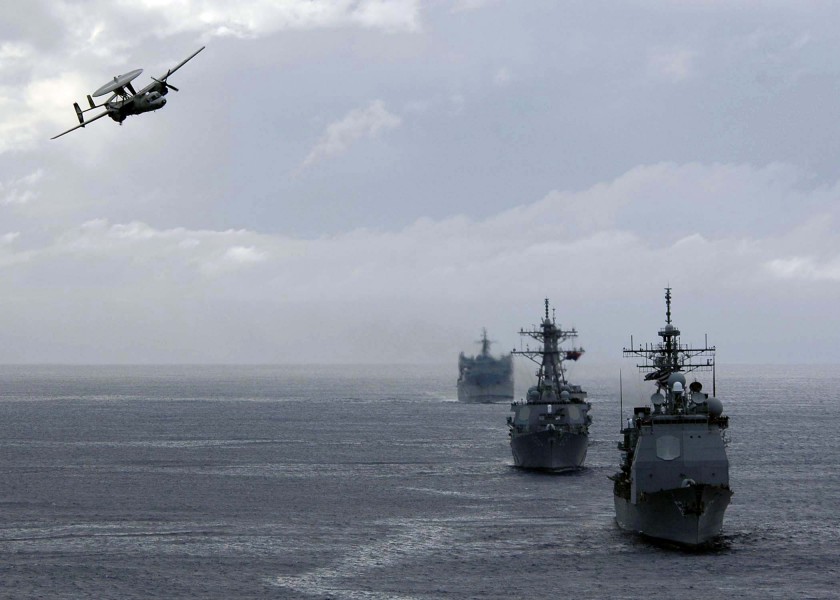 US Navy 050225-N-6074Y-166 An E-2C Hawkeye conducts a flyby in front of the ships belonging to Commander Destroyer Squadron Nine (CDS-9)