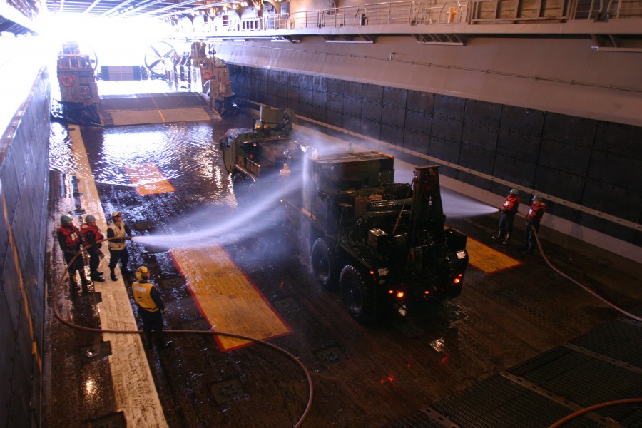 US Navy 050326-M-5900L-053 U.S. Marine Corps vehicles, assigned to the 26th Marine Expeditionary Unit (MEU), are washed in the well deck aboard the amphibious assault ship USS Kearsarge (LHD 3) 