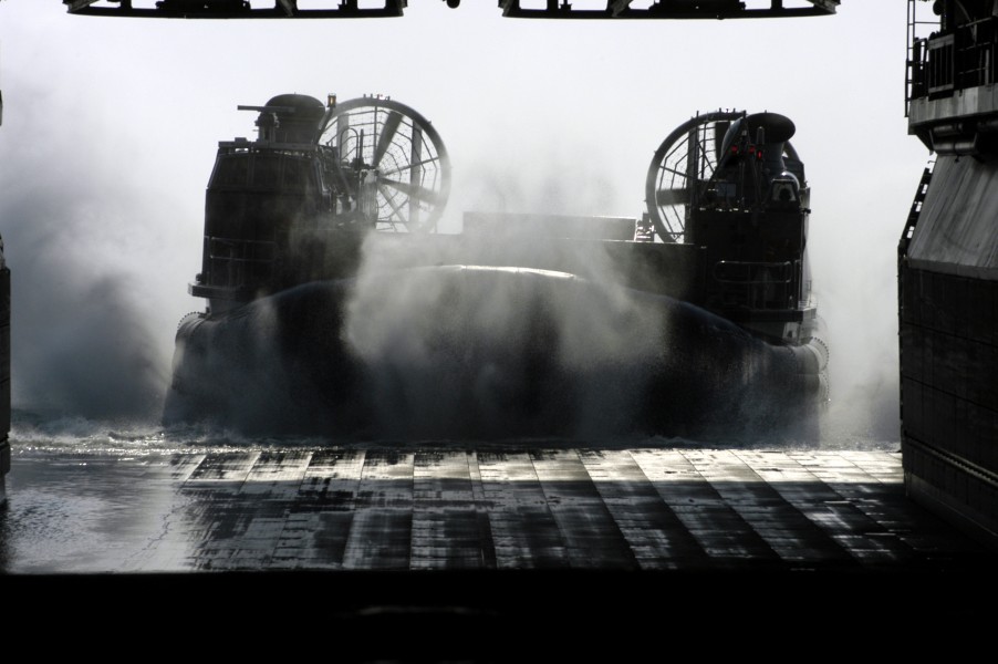 US Navy 050422-N-8154G-061 A Landing Craft, Air Cushion (LCACs), assigned to Assault Craft Unit Four (ACU-4), enters the well deck of the amphibious assault ship USS Bataan (LHD 5) off the Virginia coast