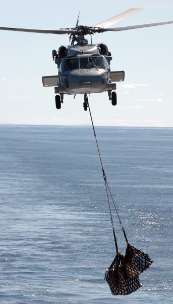 US Navy 050618-N-9551Z-020 An MH-60S Seahawk helicopter, assigned to Helicopter Sea Combat Squadron Two Five (HCS-25), conducts a vertical replenishment