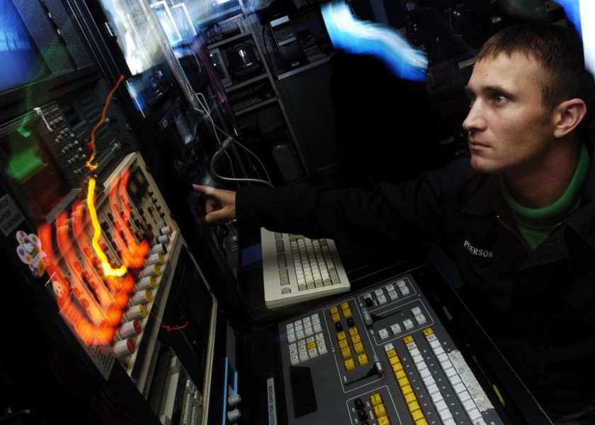 US Navy 050915-N-0499M-017 Photographer's Mate 2nd Class Seth Peterson, stands SITE TV watch in the television studio aboard the Nimitz class aircraft carrier USS Abraham Lincoln (CVN 72)