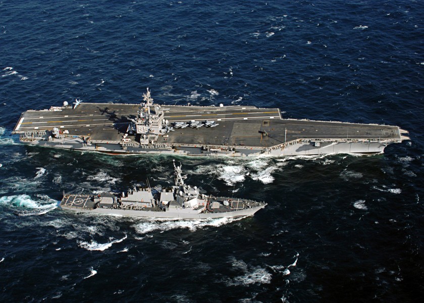 US Navy 060206-N-7748K-004 The nuclear-powered aircraft carrier USS Enterprise (CVN 65) conducts a refueling at sea with the guided missile destroyer USS McFaul (DDG 74)