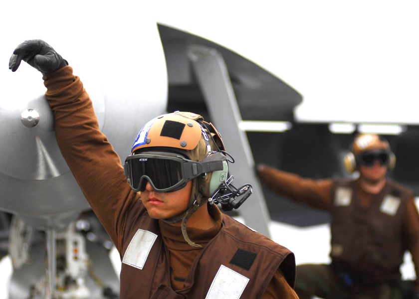 US Navy 060310-N-0499M-062 A plane captain stands by during flight operations on the flight deck aboard the Nimitz-class aircraft carrier USS Abraham Lincoln (CVN 72)