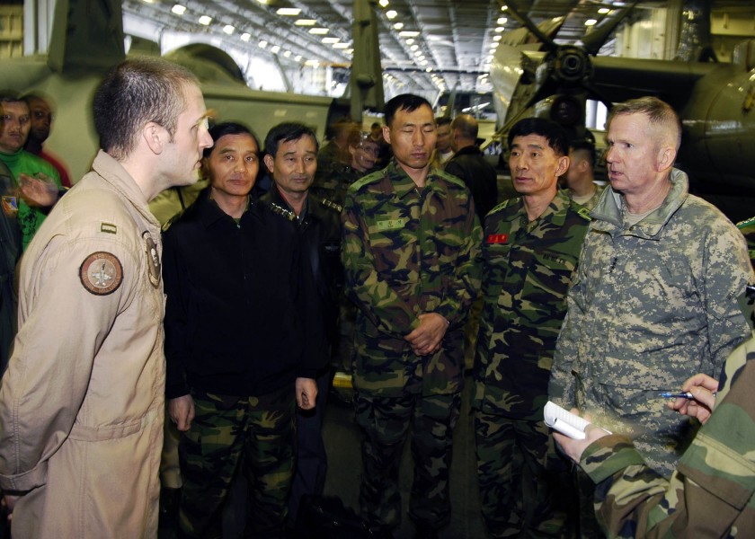 US Navy 060329-N-7981E-016 Commander United Nations Command-Combined Forces Command- United States Forces Korea, Gen. B.B. Bell, discusses the capabilities of the F-A-18E Super Hornet with Lt. Mitchell Koch
