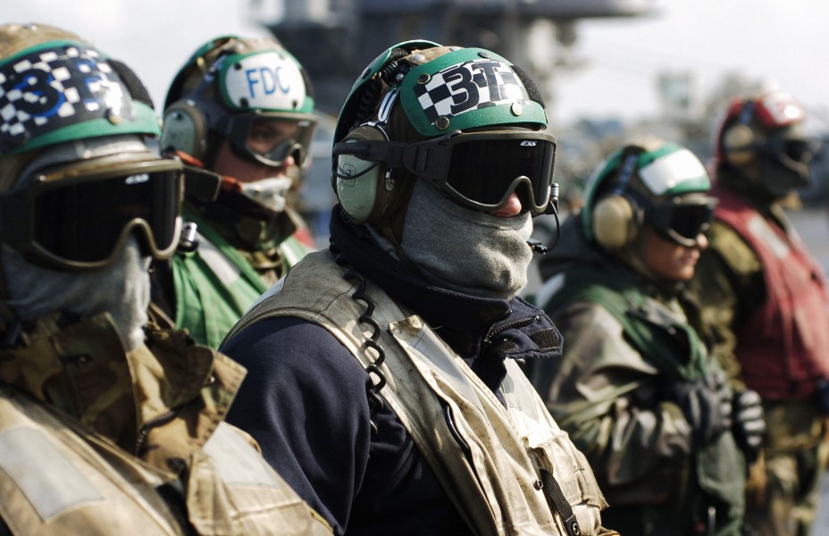 US Navy 060330-N-4166B-089 Sailor's seeking warmth by wearing their flash gear watch as an F-A-18F Super Hornet assigned to the Fighting Vigilantes^rdquo, of Strike Fighter Squadron One Five One (VFA-151)