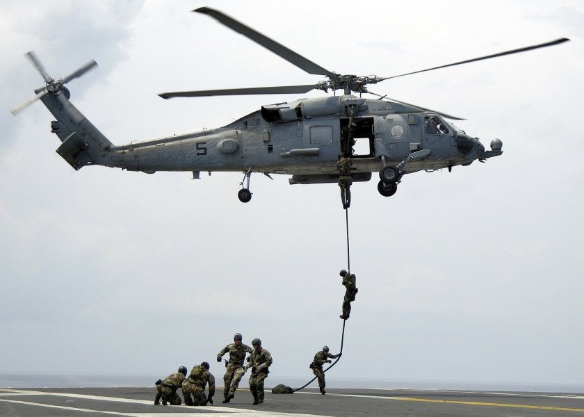 US Navy 060417-N-4166B-068 Members of Explosive Ordnance Disposal Mobile Unit Eleven (EODMU-11) Detachment 9, fast rope from an SH-60F Seahawk helicopter