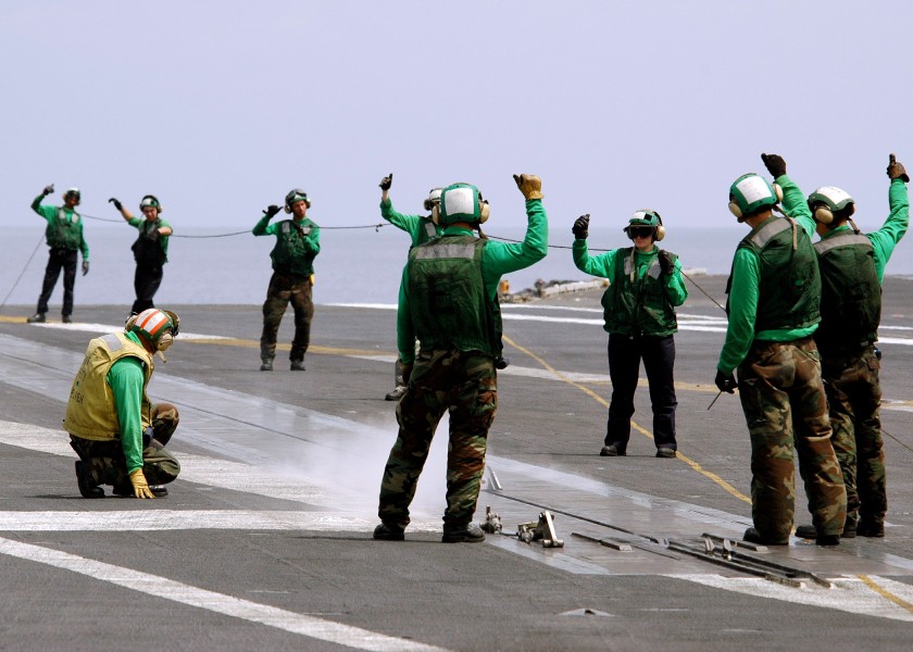 US Navy 060424-N-9079D-008 Aviation Boatswain's Mate give the thumbs up for the launch of a no-load off of one of four steam powered catapults 