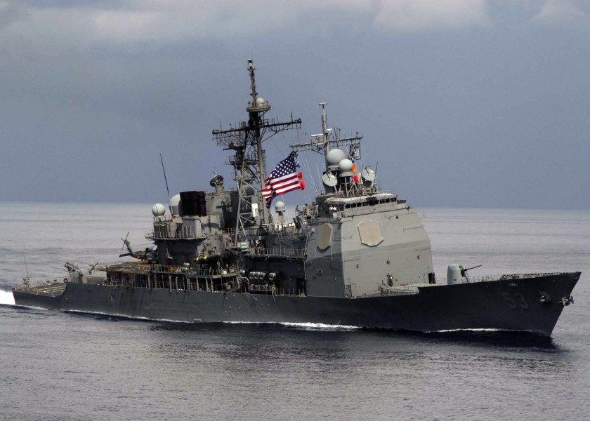 US Navy 060503-N-6060O-167 The guided-missile cruiser USS Mobile Bay (CG 53) performs a pass-in-review with the Nimitz-class aircraft carrier USS Abraham Lincoln (CVN 72)