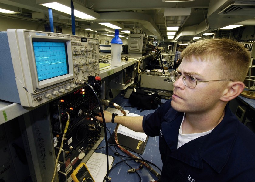US Navy 060504-N-7981E-012 Aviation Electronics Technician Airman Gary Kopf uses an oscilloscope to verify signals on aircraft avionics equipment aboard the Nimitz-class aircraft carrier USS Abraham Lincoln