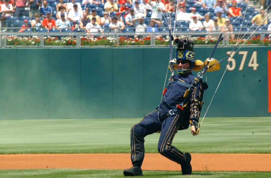 US Navy 060618-N-4729H-087 Chief Damage Controlman J.C. Ledbetter assigned to the Navy Parachute Team Leapfrogs, hits the ground at Citizens Bank Park