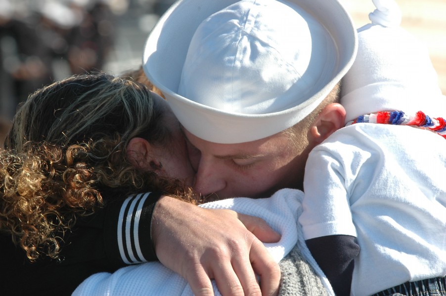 US Navy 061106-N-4515N-191 Damage Controlman 3rd Class Mark Corradi greets his family at the homecoming ceremony for the guided-missile destroyer USS Ross (DDG 71)
