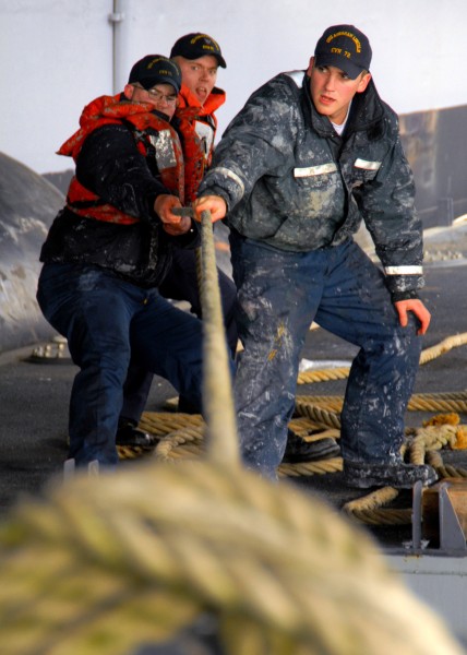 US Navy 070314-N-7981E-138 Members of Deck Department's paint team work to reposition a painting barge underneath an elevator on the Nimitz-class aircraft carrier USS Abraham Lincoln (CVN-72)
