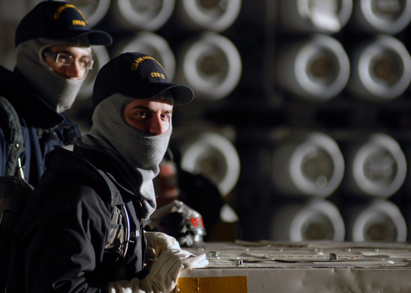 US Navy 071016-N-7981E-092 Members of air department stand fire watch in the hangar bay of Nimitz-class aircraft carrier USS Abraham Lincoln (CVN 72) during an ordnance onload at Naval Magazine Indian Island
