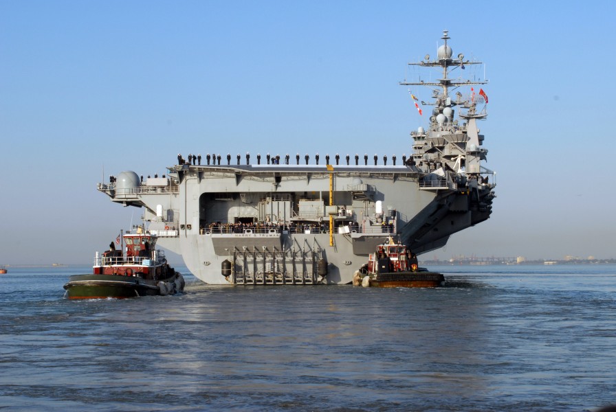 US Navy 071105-N-7597A-091 Sailors aboard Nimitz-class aircraft carrier USS Harry S. Truman (CVN 75) man the rails as the ship transits the Chesapeake Bay