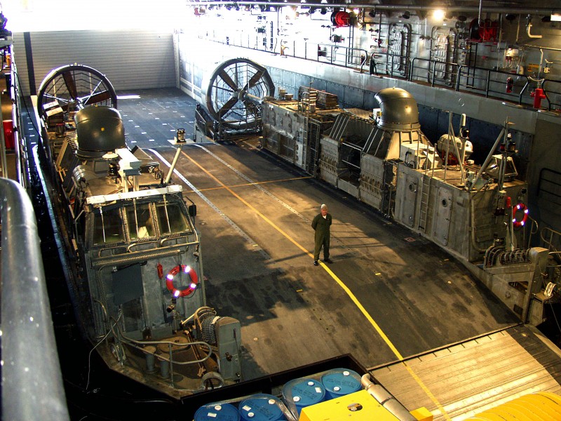 US Navy 071212-N-8318B-001 Chief Craftmaster Charles Moore, assigned to Assault Craft Unit (ACU) 4, awaits tour groups aboard a landing craft air cushion (LCAC)