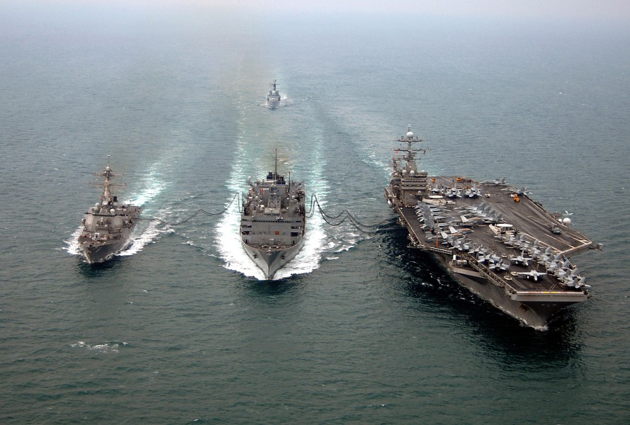 US Navy 080123-N-0535P-425 The Arleigh Burke-class guided-missile destroyer USS Winston S. Churchill (DDG 81), left, performs an emergency breakaway maneuver during a replenishment at sea