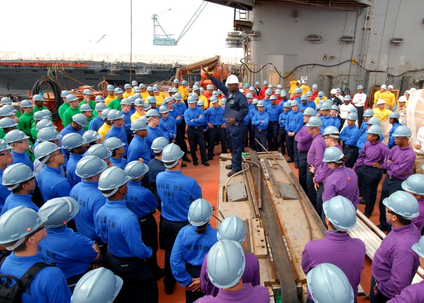US Navy 080831-N-5658B-081 The Air Boatswain from Pre-Commissioning Unit (PCU) George H.W. Bush (CVN 77) addresses Air Department Sailors