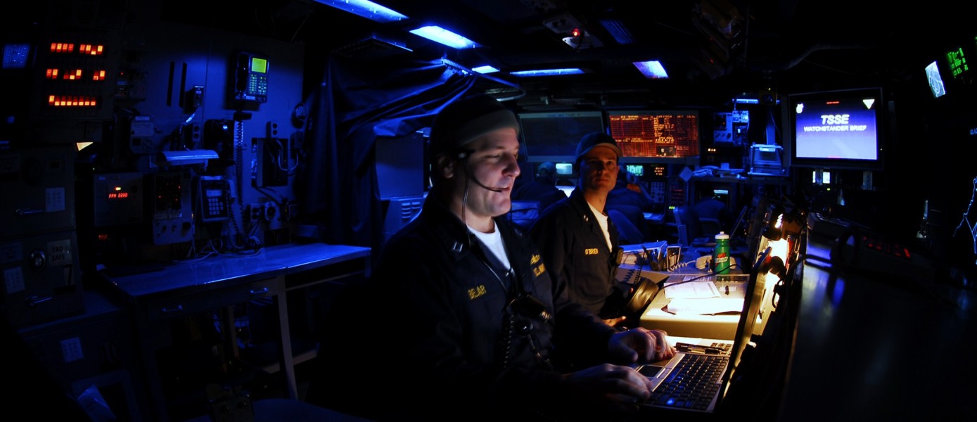 US Navy 090226-N-6538W-068 Lt. Jon Bielar and tactical action officer Lt. Paul O'Brien call general quarters