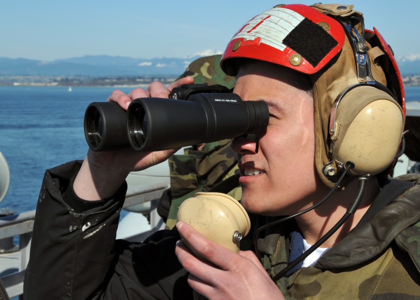 US Navy 090406-N-0774H-010 Airman Paolo Mongon, from Flanders, N.J., stands watch as part of the small craft actions team aboard the aircraft carrier USS Abraham Lincoln (CVN 72)