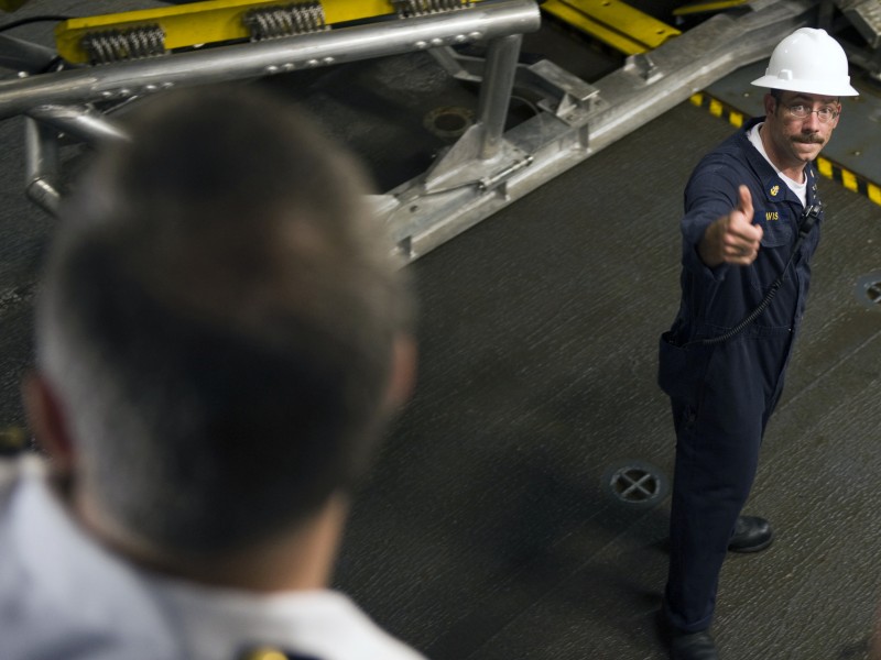US Navy 090504-N-7090S-449 Chief Boatswain's Mate Trevor Davis gives thumbs up to Cmdr. Michael P. Doran, commanding officer of USS Freedom (LCS 1), prior to launching a small boat from the well deck of Freedom