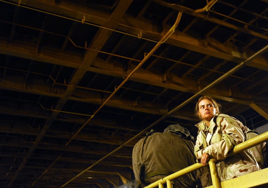 US Navy 090515-N-5345W-529 Construction Mechanic 2nd Class Heather Billings, assigned to Beach Master Unit 2 (BMU 2), watches from atop a Lighter Amphibious Resupply Cargo (LARC)
