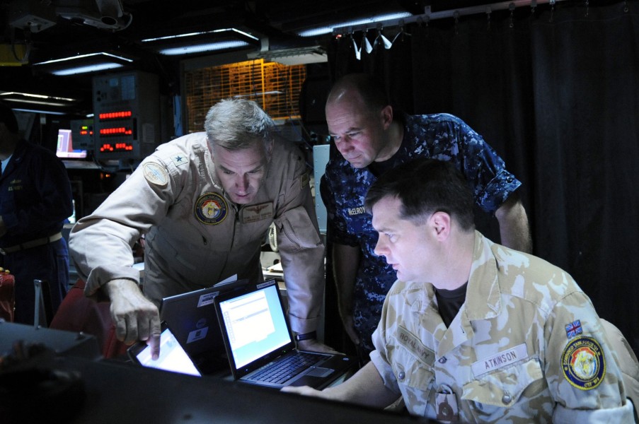 US Navy 091001-N-4154B-049 Rear Adm. Scott E. Sanders, commander of Combined Task Force (CTF) 151, and Capt. Paul McElroy, deputy commander of CTF 151