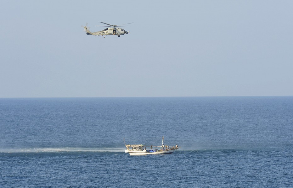 US Navy 091014-N-9500T-018 An SH-60B Sea Hawk assigned to Helicopter Anti-Submarine Squadron Light (HSL) 48 hovers above a suspicious dhow in the Gulf of Aden
