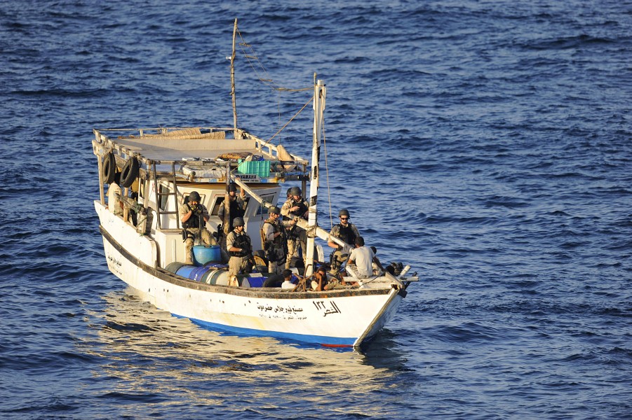 US Navy 091014-N-9500T-224 Members of the visit, board, search and seizure team from the guided-missile cruiser USS Anzio (CG 68) search a suspicious dhow during counter-piracy operations in the Gulf of Aden