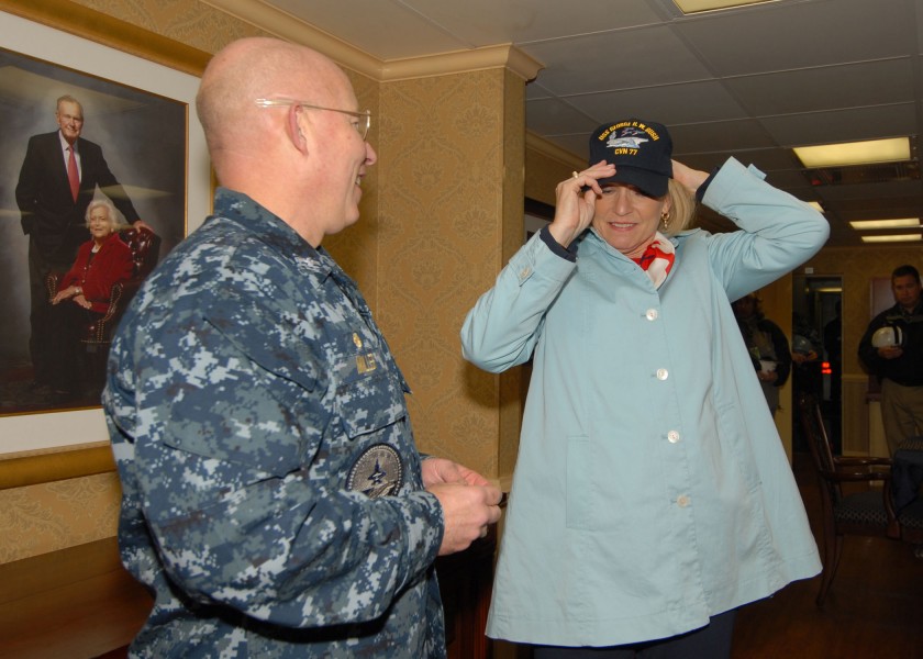 US Navy 091113-N-8560K-057 Capt. Chip Miller, commanding officer of the aircraft carrier USS George H.W. Bush (CVN 77), presents a command ball cap to Susan Ford Bales