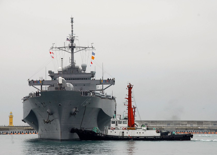US Navy 100305-N-9573A-005 A tug boat guides the U.S. 7th Fleet command ship USS Blue Ridge (LCC 19) as it arrives in Busan, Republic of Korea